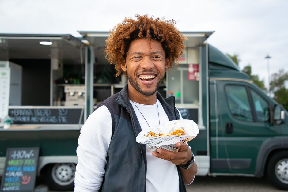 Happy customers enjoying expertly prepared smash burgers